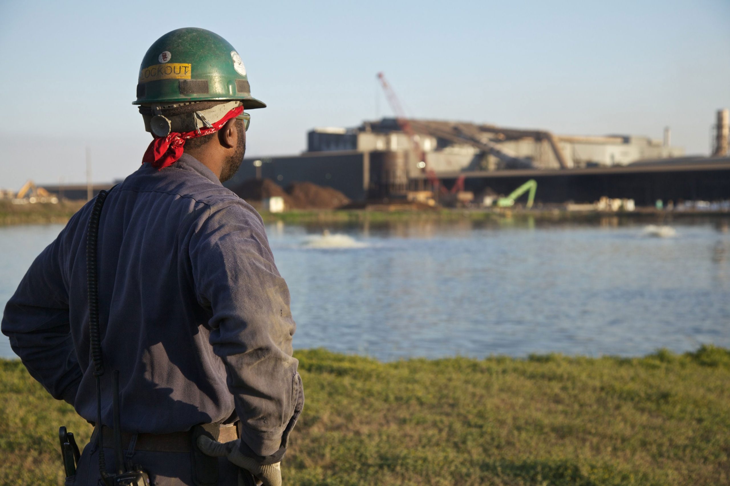 Nucor teammate outside looking at the exterior of a Nucor steel mill