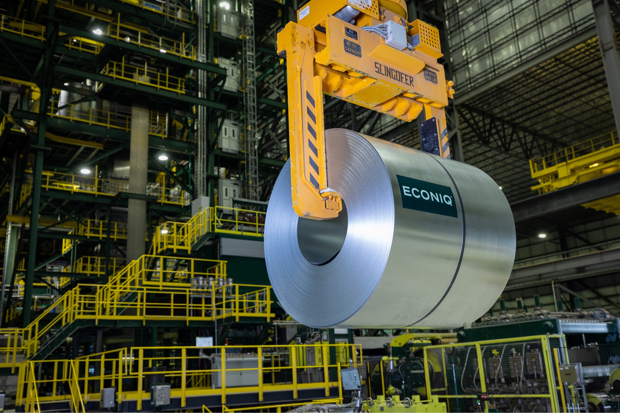 Photo of a coil of Nucor Econiq sheet steel being transported in warehouse