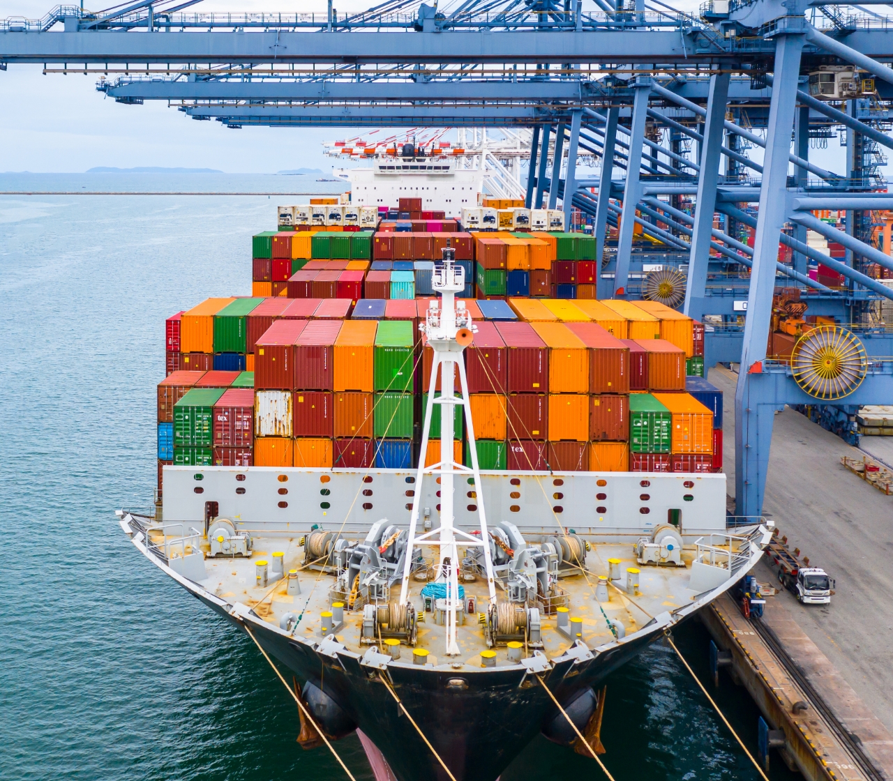 photo of shipping containers on top of transportation ship