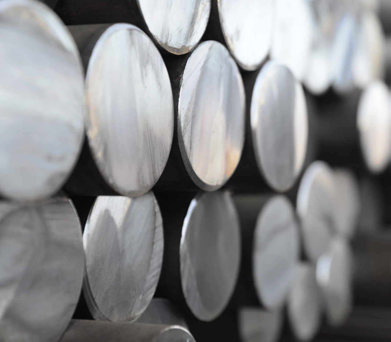 Photo of a stack of Nucor hot rolled steel bar